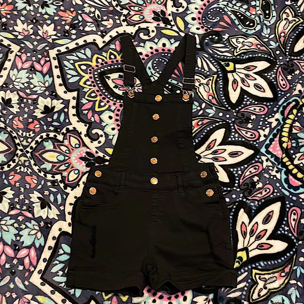 I’m selling a black gold overall size 12